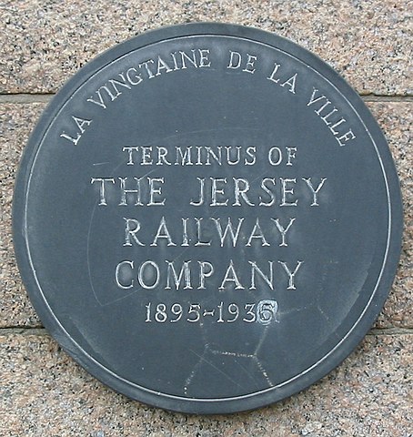 Historical marker plaque for the Jersey Railwas and Tramways Ltd. at St Helier, Jersey. Man vyi, Public domain, via Wikimedia Commons